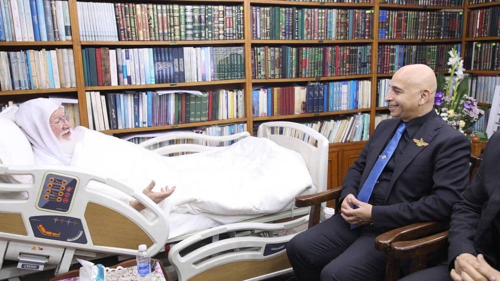 His Eminence the senior scholar (may his shade endure) Dr. Haidar Asfour, and the accompanying delegation, were received at his residence in the holy city of Kazimiyah, where they came to inquire about his health.