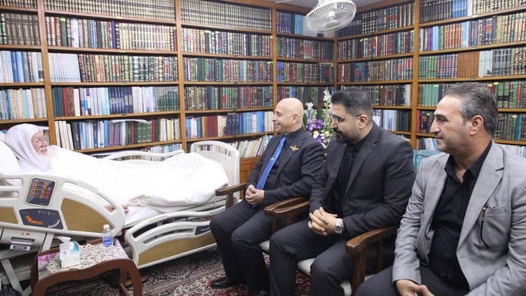 His Eminence the senior scholar (may his shade endure) Dr. Haidar Asfour, and the accompanying delegation, were received at his residence in the holy city of Kazimiyah, where they came to inquire about his health.