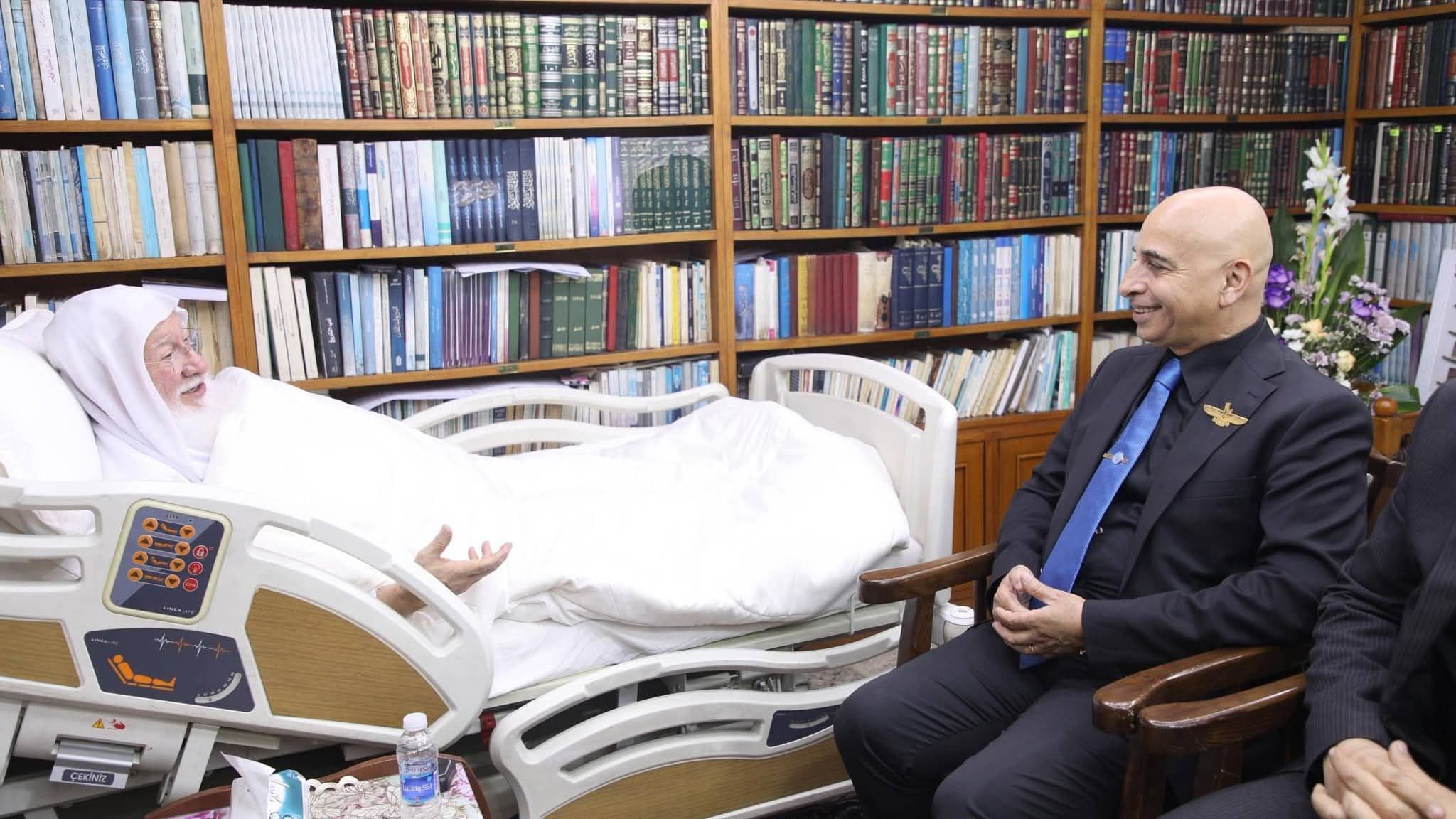His Eminence the senior scholar (may his shade endure) Dr. Haidar Asfour, and the accompanying delegation, were received at his residence in the holy city of Kazimiyah, where they came to inquire about his health.