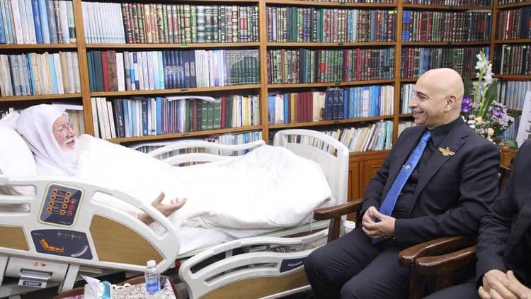 His Eminence the senior scholar (may his shade endure) Dr. Haidar Asfour, and the accompanying delegation, were received at his residence in the holy city of Kazimiyah, where they came to inquire about his health.